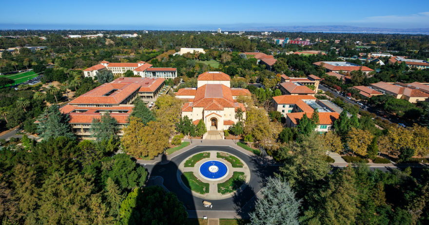 An overhead drove perspective of the main fountain on the Stanford campus.