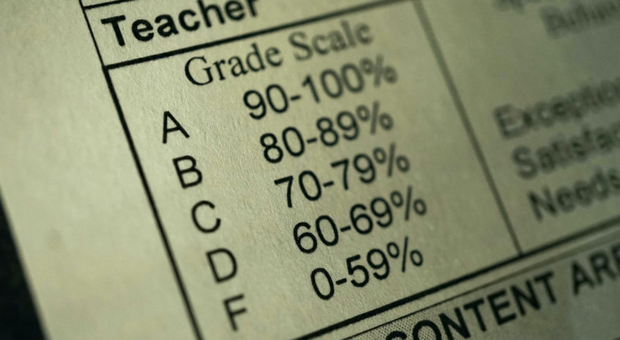 A grade scale explanation table from a standardized testing form.