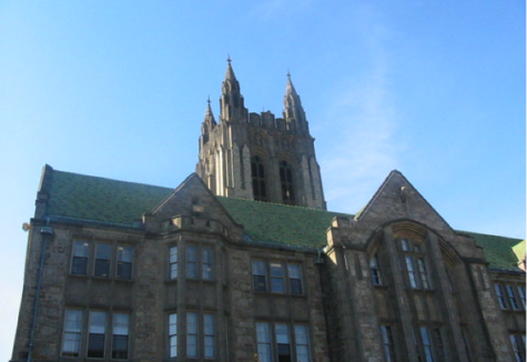 The large stone face of one of the massive buildings in Massachusetts.